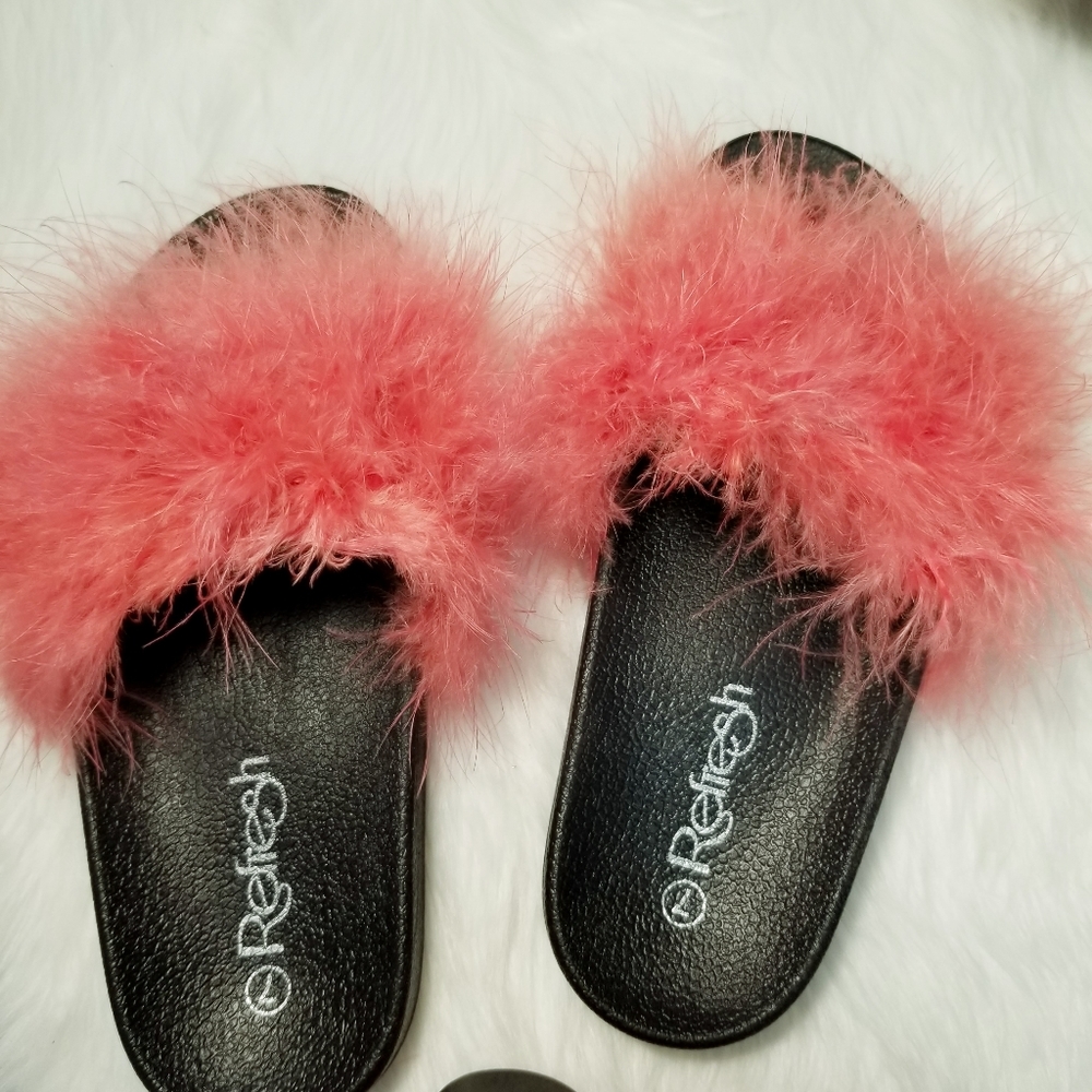 Feather covered slide sandals.